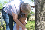 Adult with arms around child